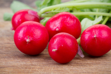 Radishes on kitchen board