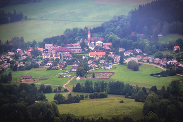 Small Machov town in Czech Republic, view from tourist attraction of Table Mountains called Errant Rocks in Sudetes, Poland