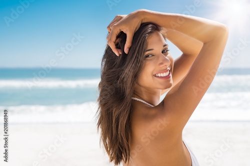 Beautiful woman on beach smiling Beautiful woman on beach smiling