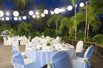 Romantic dinner setting with garden background