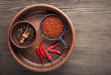 Selection of spices pepper. Food background on black wood table. Top view copy space
