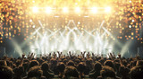 Concert venue crowded with clapping fans. Distress effects and lens flare are visible