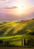 Italy; San Quirico d'Orcia; sunset over Tuscan Valdorcia rolling hills
