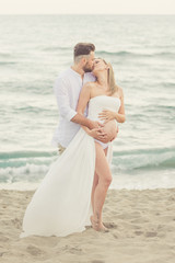 couple pregnancy near the sea