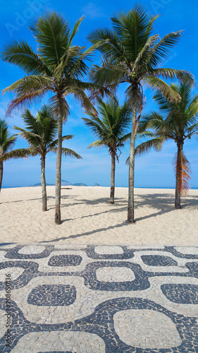 Famous Ipanema Mosaic Sidewalk With Palm Trees in the Beach, in Rio de Janeiro, Brazil Famous Ipanema Mosaic Sidewalk With Palm Trees in the Beach, in Rio de Janeiro, Brazil