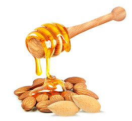 almond nuts and honey dripping on a white background