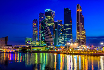 Skyscrapers of Moscow City business center and Moscow river in Moscow at night, Russia