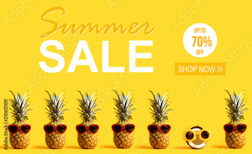 Фото: Summer Sale with pineapples and a coconut wearing sunglasses Summer Sale with pineapples and a coconut wearing sunglasses