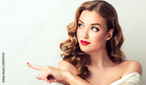 Фото: Woman surprise showing product .Beautiful girl with curly hair pointing to the side . Presenting your product. Isolated on white background. Expressive facial expressions
Woman surprise showing product .Beautiful girl with curly hair pointing to the side . Presenting your product. Isolated on white background. Expressive facial expressions