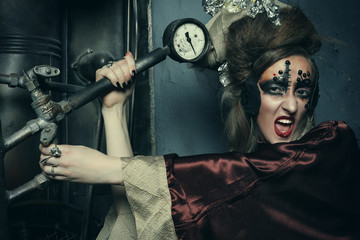 Aggressive stylish steampunk lady in a creative interior. Art an