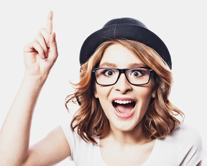 Happy  young student woman  in fashion glasses and black  hat on white background 