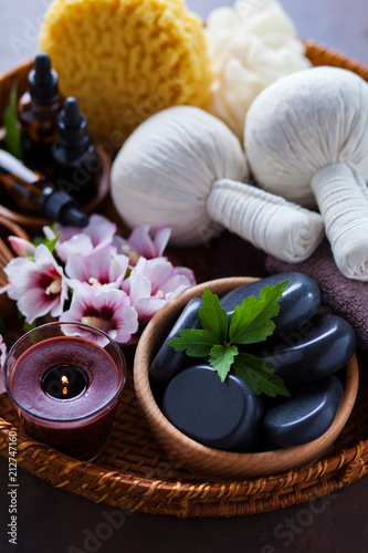 spa setting with hibiscus flowers on brown spa setting with hibiscus flowers on brown