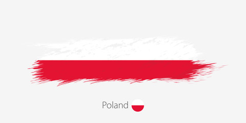 Flag of Poland, grunge abstract brush stroke on gray background.
