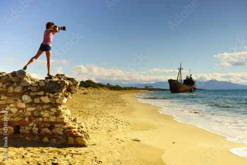 Tourist take photo on beach sea shore Tourist take photo on beach sea shore