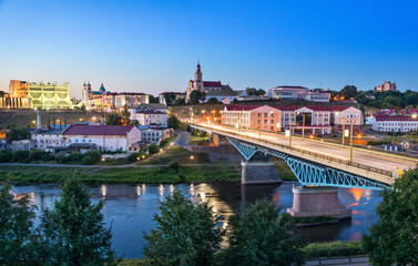 Cityscape of Grodno at dusk with bridge over Neman river, Belarus