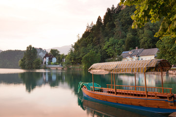 Touring boats at sunset on famous Lake Bled, Slovenia