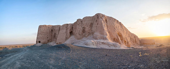 Panoramic view of ruins of Djanpik Qala: 9-10th century Khorezm fotress on sunset, Karakalpakstan region, Uzbekistan