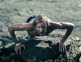 Healthy athlete doing push ups