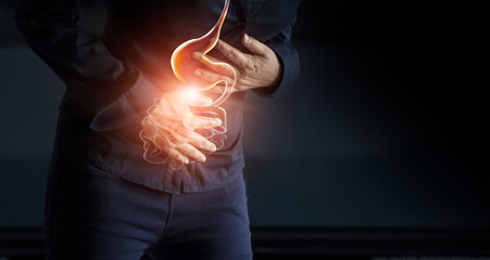 Woman touching stomach painful suffering from stomachache causes of menstruation period, gastric ulcer, appendicitis or gastrointestinal system disease. Healthcare and health insurance concept