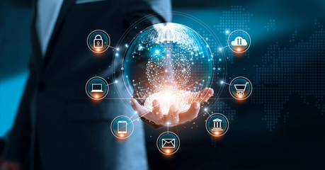 Digital marketing. Businessman holding global circle modern interface payments online shopping and icon customer network connection on virtual screen. Data exchanges worldwide.