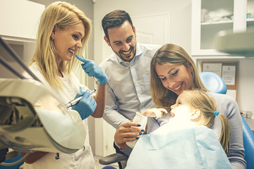 Family in dental office
