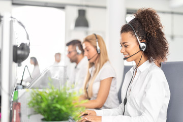 Call center worker accompanied by her team.