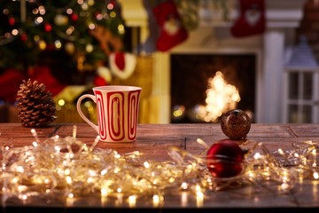 Christmas still life with mug and fireplace