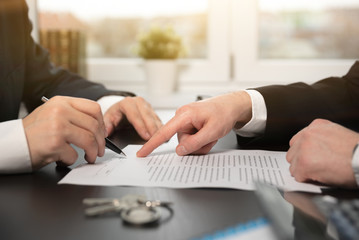 Real estate agent signing a contract buy-sell home