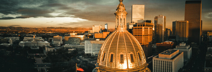 Aerial drone photo - Sunrise over the golden Colorado State Capitol Building.  Denver