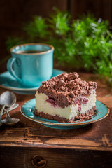 Closeup of homemade cheesecake served with coffee