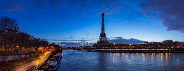 Eiffel Tower and  Seine River banks in early morning light. Panoramic view in Paris, France