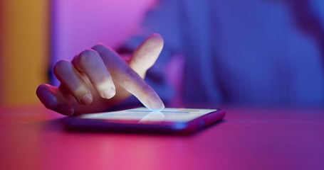 Woman use of mobile phone at night