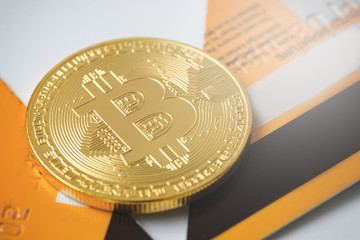 Bitcoin and broken credit card on white background