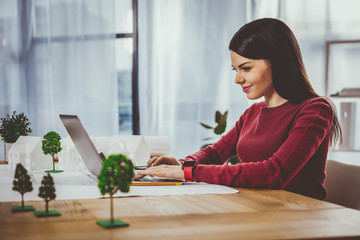 Positive joyful woman typing