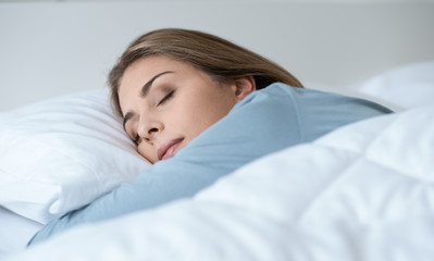 Young woman sleeping in the bedroom
