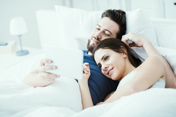 Couple connecting with a tablet