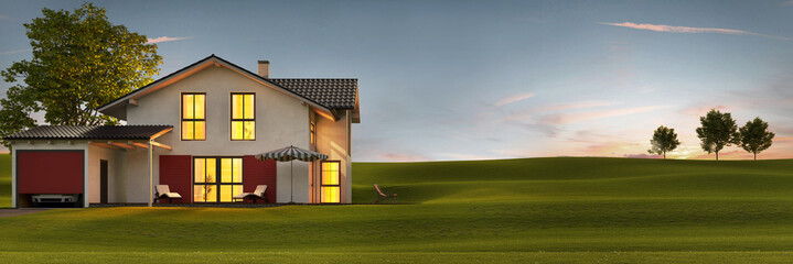 Evening view of a modern house with garden and terrace