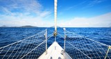 View from the bow of a yacht with a view of calm blue sea