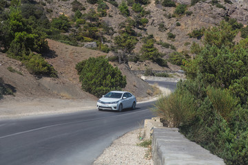 Car Moves along a winding road