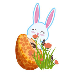 cute rabbit with easter egg painted in the garden