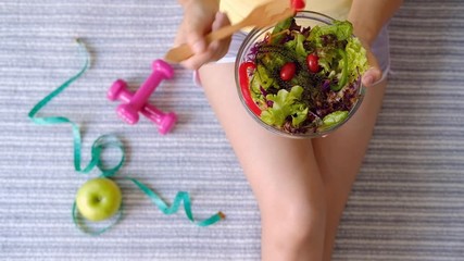Young woman eating homemade healthy salad at home, Healthy lifestyle, diet concept