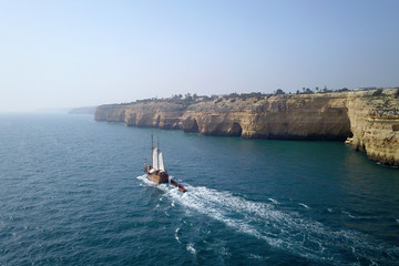beautiful turquoise ocean water with boat on it top view aerial photo