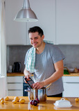 Young man cooking at kitchen by self