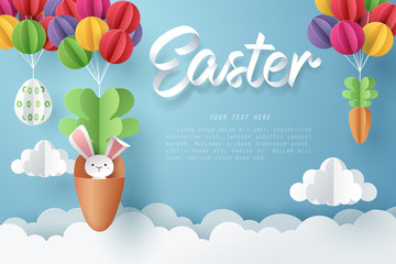 Paper art of Bunny in carrot and Easter eggs hang on colorful balloons, Happy Easter celebration concept