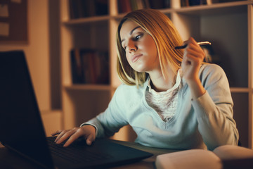 Student learning at home. Watching online course.