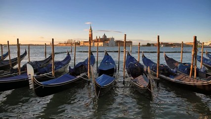 Venice gondolas at sunrise in Grand Canal by San Marco square in Venice, Italy. 