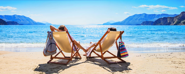 Happy Couple Relaxing on the Beach