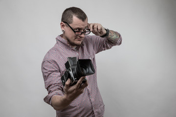man with camera and glasses