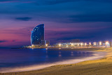 Barcelona Beach in summer night along seaside in Barcelona, Spain. Mediterranean Sea in Spain.