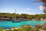A yatch standing in Cala Macarelleta in Menorca island, mediterranean sea, Spain